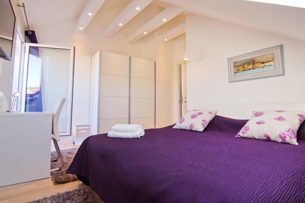 Laura Lux Suites Split Quarto foto