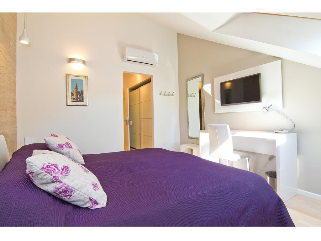Laura Lux Suites Split Quarto foto